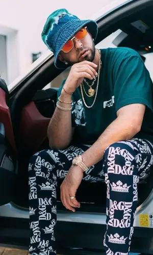 Justin Quiles wearing Dolce & Gabbana trousers