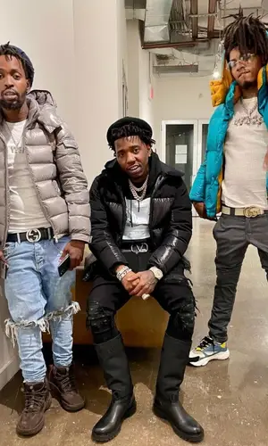 YFN Lucci wearing Dior boots