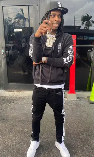 Polo G wearing New Era cap