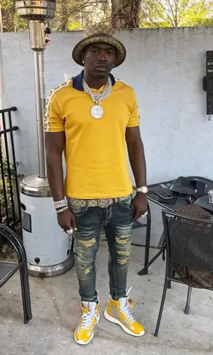 Bankroll Freddie wearing Louis Vuitton backpack