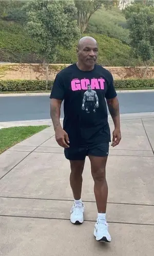 Mike Tyson wearing Mike Tyson Merch t-shirt