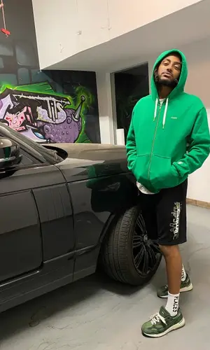 Amine wearing Places + Faces shorts