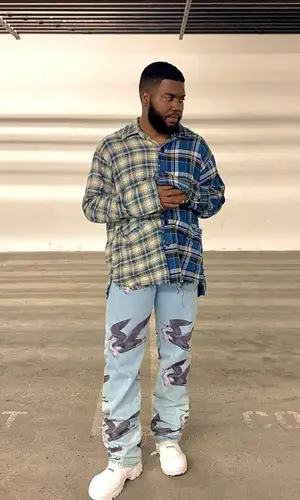 Khalid wearing Heron Preston jeans