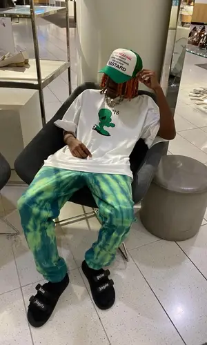 DP Kid wearing I Never Heard of You cap