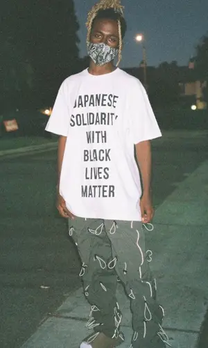 DP Kid wearing 99percentis pants