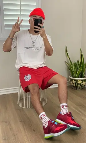 John wearing Maybe Tomorrow hat