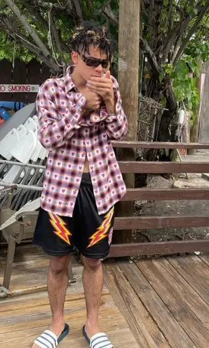 Iann Dior wearing Adidas sandal