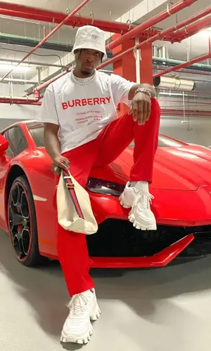 Jordan Tupak wearing Gucci bag