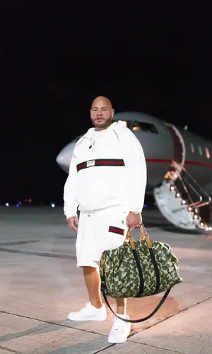 Fat Joe wearing Louis Vuitton bag