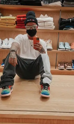 J Balvin wearing J Balvin Merch hat