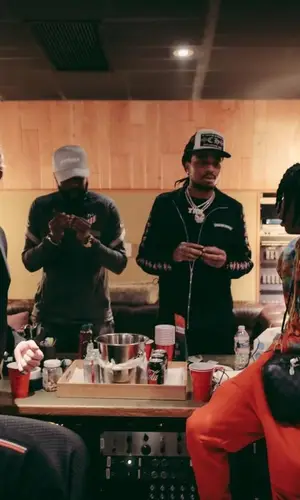 Polo G wearing Louis Vuitton bag