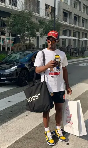 Jamont wearing Nike sneakers