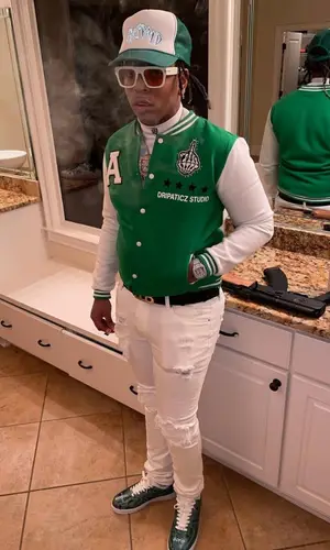 Lil Gotit wearing Selfpaid cap