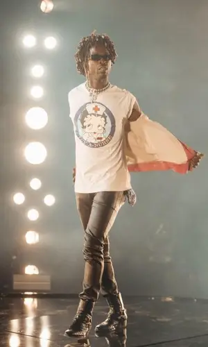 Saint JHN wearing Saint Laurent pants