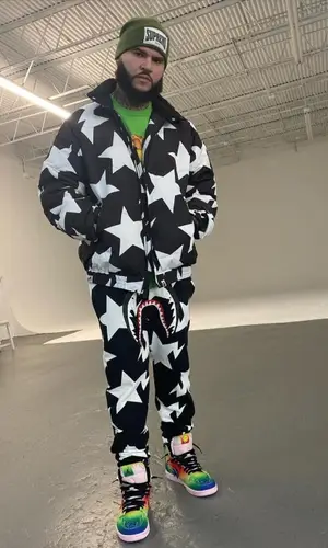 Farruko’s Outfit in Bape Jacket, J Balvin Merch Sneakers & Supreme Hat (2020)