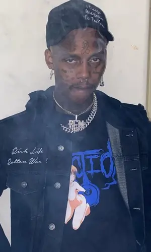 Famous Dex wearing Rich And Rotten cap