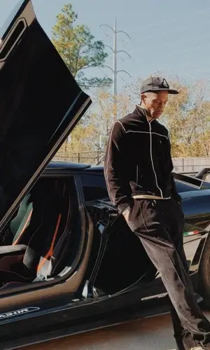 Travis Scott wearing Celine sweater