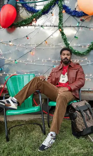 Michael B. Jordan wearing Coach bag