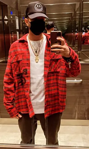 Justin Quiles wearing Fear of God jeans