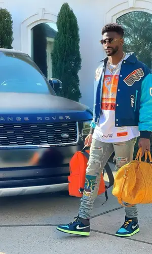Emmanuel Sanders wearing Louis Vuitton backpack