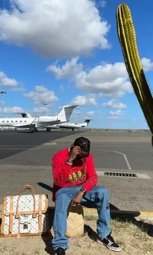 Travis Scott wearing Louis Vuitton bag