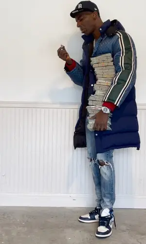 Young Dolph wearing New Era cap