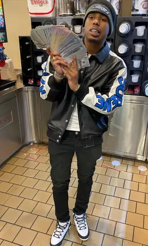 Pooh Shiesty wearing Supreme jacket