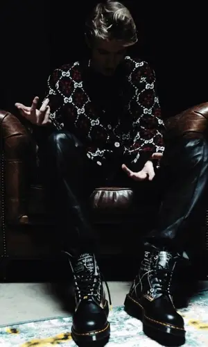 MAYOT wearing Dr. Martens boots