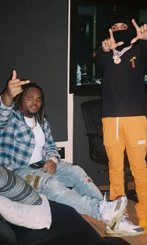 Tee Grizzley wearing Amiri shirt