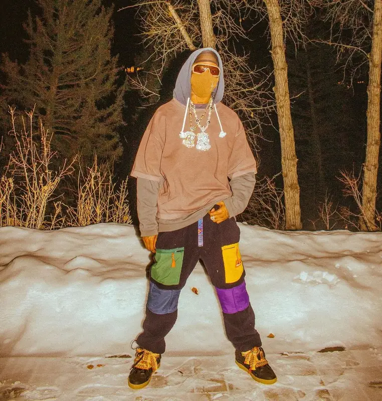 Travis Scott outfit in Prada, Takashi Murakami, and Cactus Jack, 2021