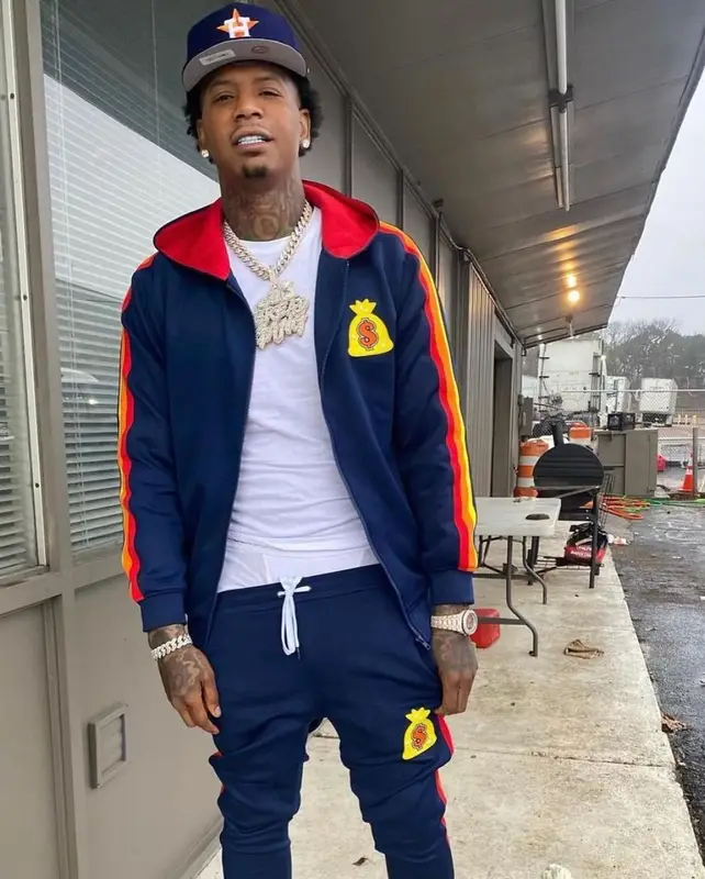 Moneybagg Yo outfit in Bread Gang, Timberland, and New Era, 2021