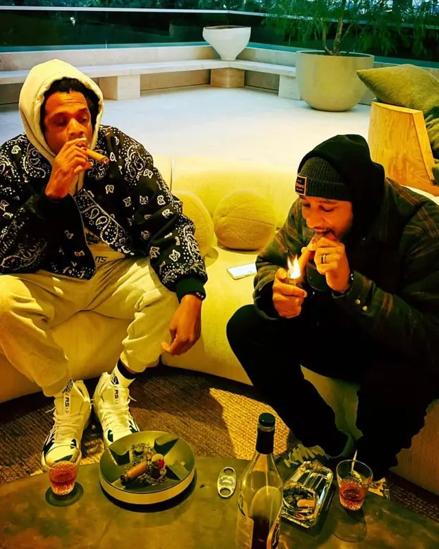 Jay-Z outfit in Rhude, Puma, and Peanuts, 2021