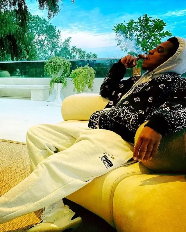 Jay-Z outfit in Rhude, Puma, and Peanuts, 2021