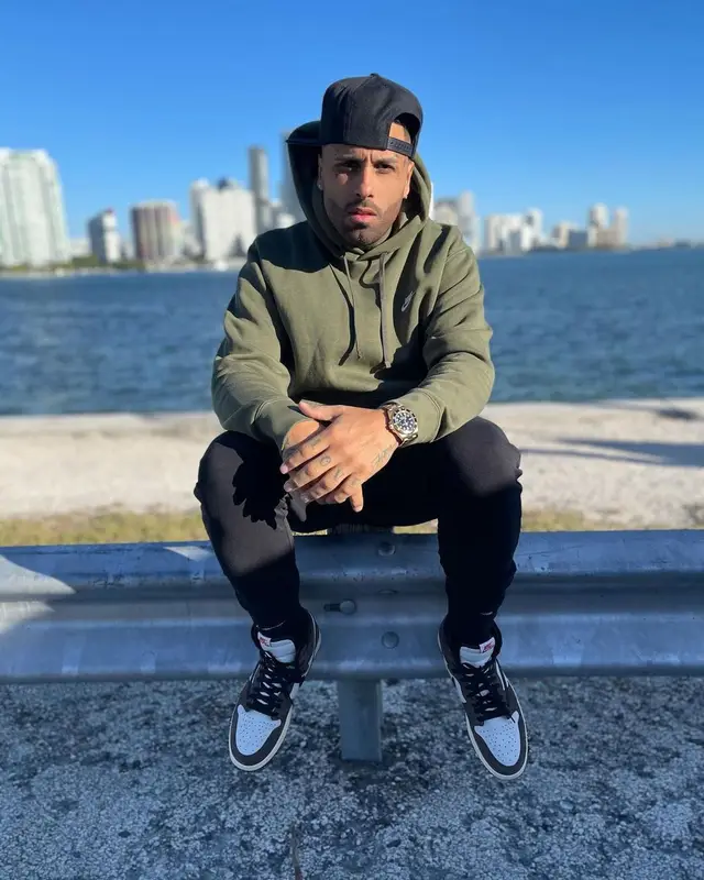 Nicky Jam outfit in Nike and Travis Scott Merch, 2021
