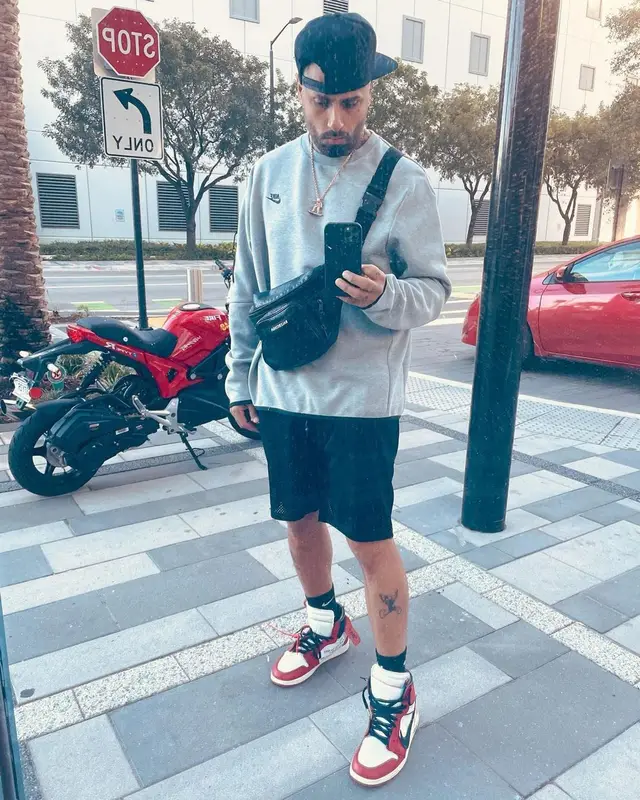 Nicky Jam outfit in Nike, Off-White, and Balenciaga, 2021