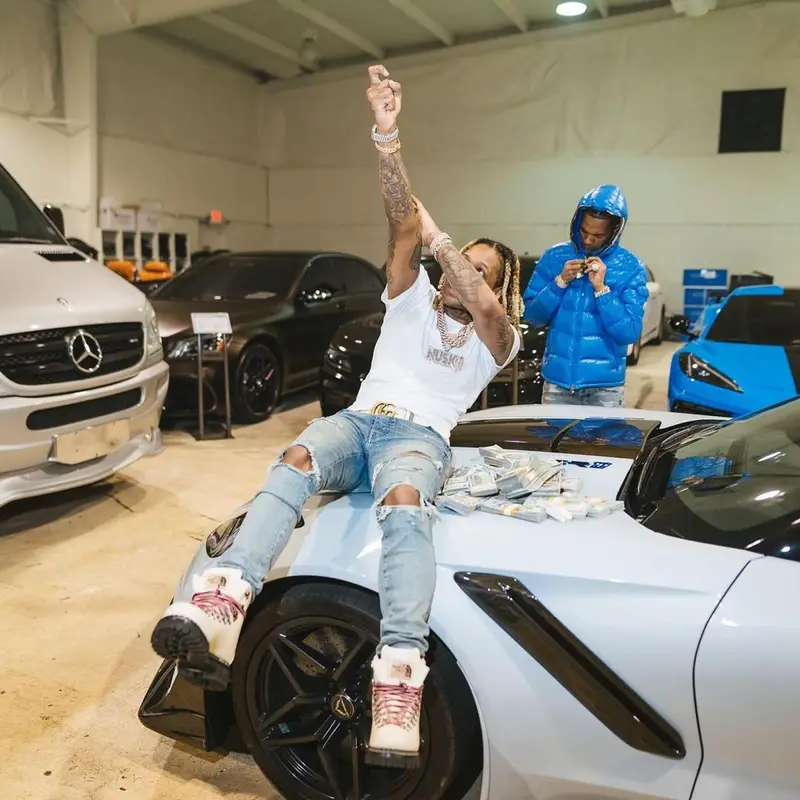 Lil Durk outfit in Gucci, Amiri, and The North Face, 2021