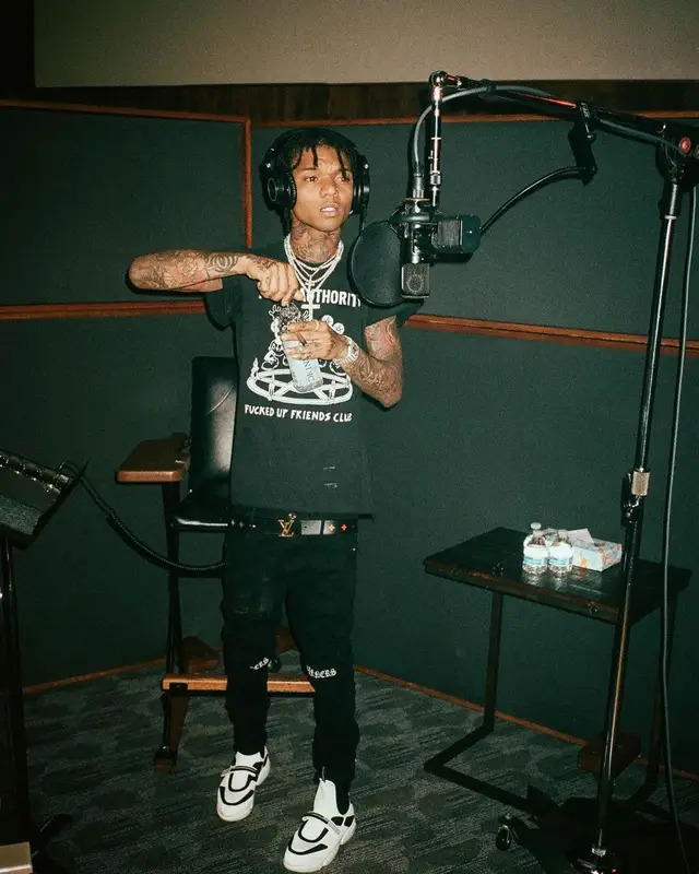 Swae Lee outfit in Rta, Louis Vuitton, and Audio Technica, 2021