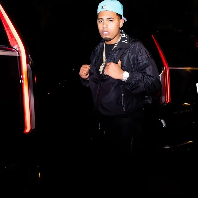Myke Towers outfit in Givenchy, Nike, and New Era, 2021