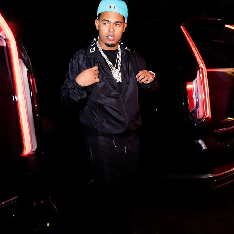 Myke Towers outfit in Givenchy, Nike, and New Era, 2021