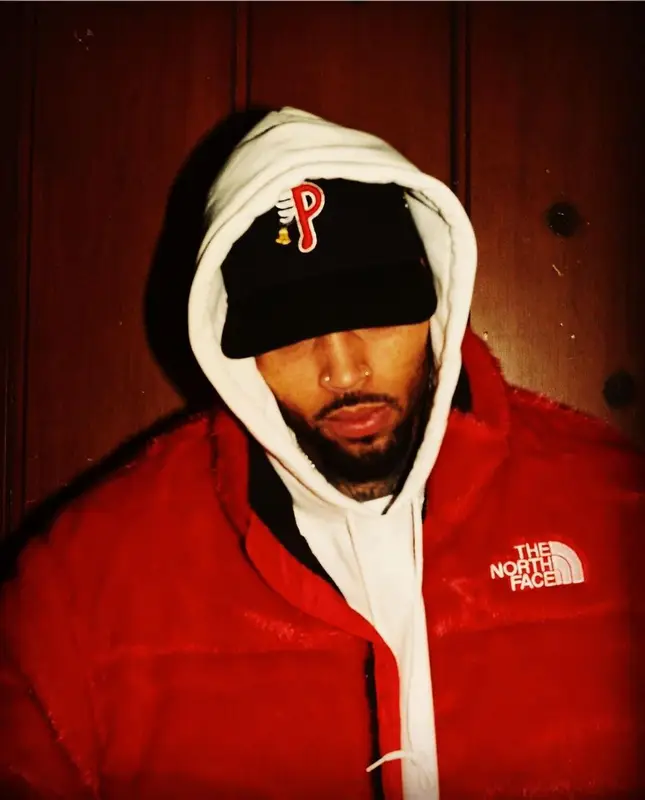 Chris Brown outfit in Supreme, Philadelphia Phillies, and The North Face, 2021