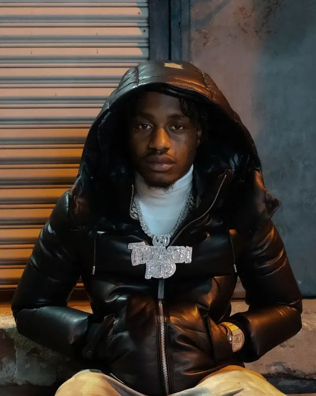Lil Tjay outfit in Purple Brand, Amiri, and Dior, 2021