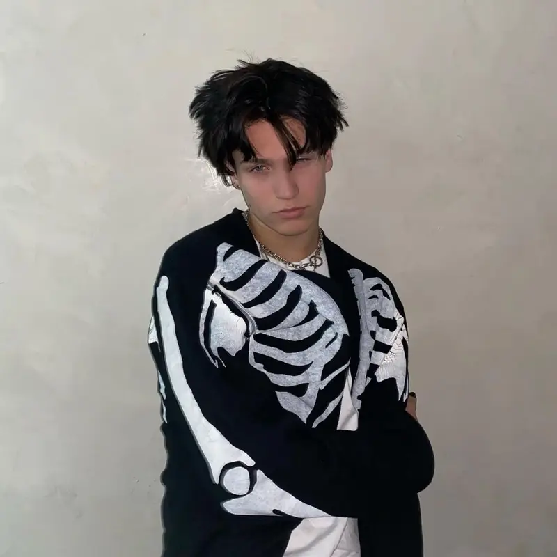 Lil Huddy outfit in Kapital, Amiri, and Machine Gun Kelly Merch, 2020