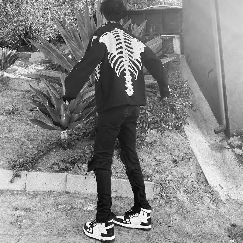 Lil Huddy outfit in Kapital, Amiri, and Machine Gun Kelly Merch, 2020