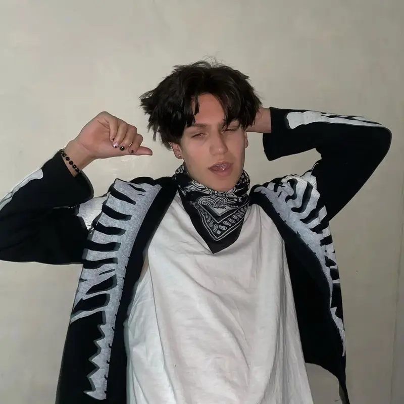 Lil Huddy outfit in Kapital, Amiri, and Machine Gun Kelly Merch, 2020