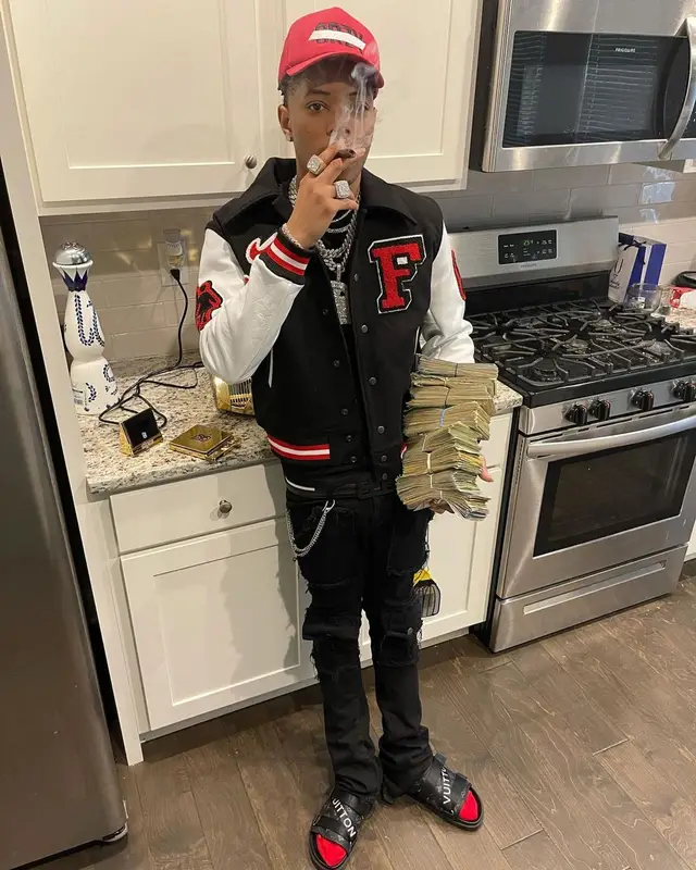 Lil Migo outfit in Homme + Femme, Valabasas, and Bally, 2021