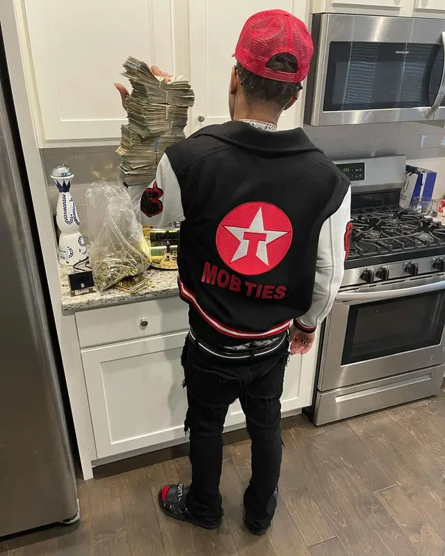 Lil Migo outfit in Homme + Femme, Valabasas, and Bally, 2021