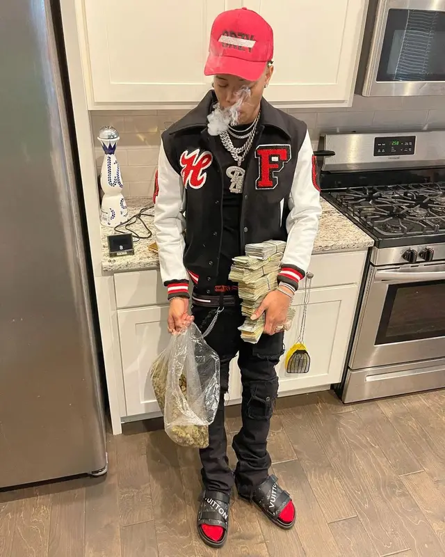 Lil Migo outfit in Homme + Femme, Valabasas, and Bally, 2021