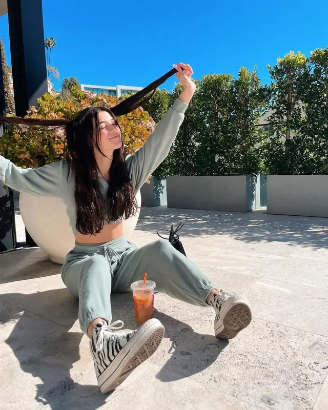 Charli D'Amelio outfit in Skims, Converse, and Balenciaga, 2021
