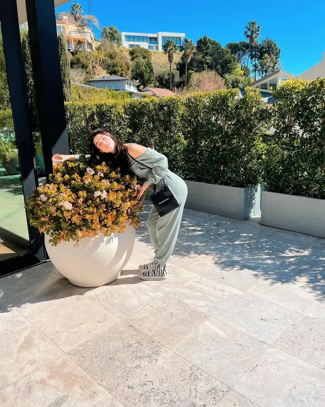 Charli D'Amelio outfit in Skims, Converse, and Balenciaga, 2021