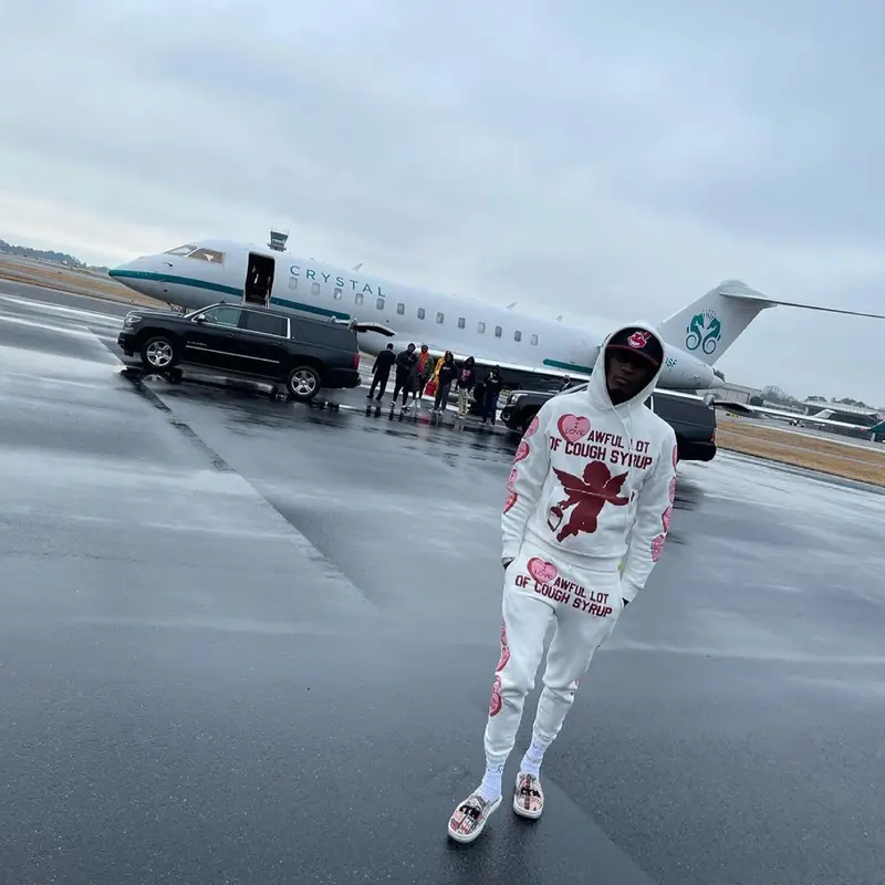 Young Thug outfit in Cough Syrup, New Era, and Market, 2021
